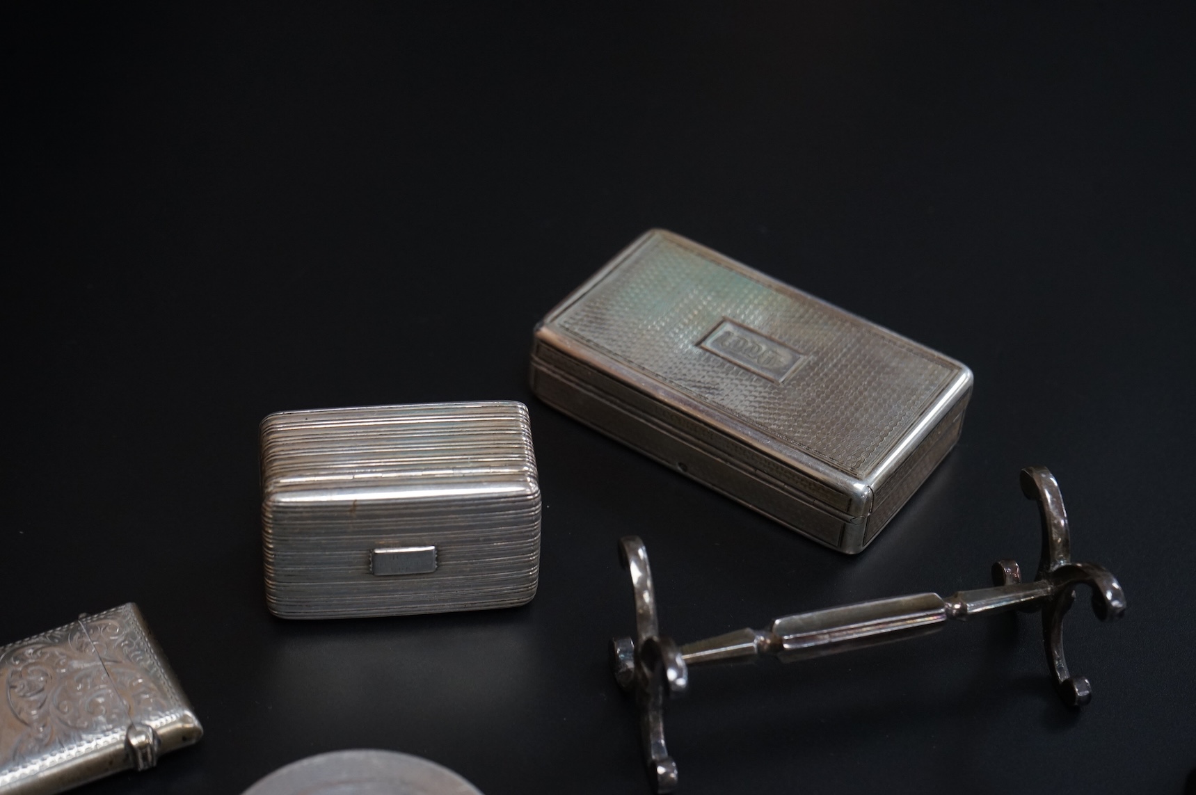 Small collectable silver including a William IV nutmeg grater by Nathaniel Mills, Birmingham, 1836, a similar snuff box, London, 1836, a 19th century vinaigrette(a.f.), a silver vesta case, an Edwardian silver pill box,